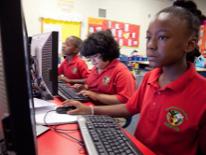 Children from the Community Academy Public Charter Schools using computers