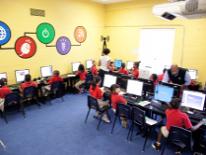 Children from the Community Academy Public Charter Schools using computers